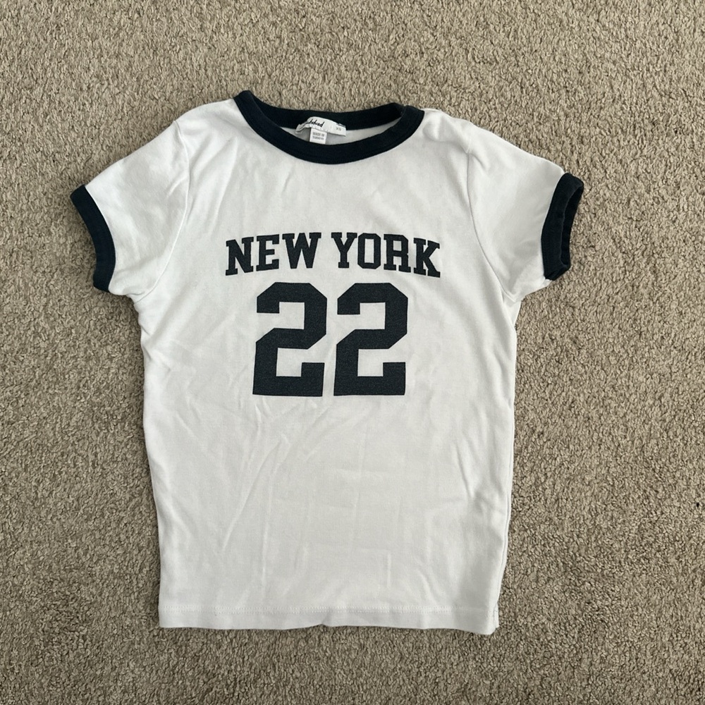 Subdued white and navy baby tee